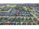 Aerial view of a Gathering-friendly neighborhood, featuring a home with a well-manicured lawn and pool at 6148 Gracie Pl, Lakeland, FL 33812