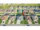 Aerial view of the neighborhood featuring a home with well-maintained landscaping and a private backyard pool at 6148 Gracie Pl, Lakeland, FL 33812