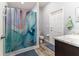 This bathroom features a shower with curtain and a tiled floor at 6148 Gracie Pl, Lakeland, FL 33812