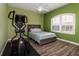 Bright bedroom with a ceiling fan, ample natural light from the window, and wood-look flooring at 6148 Gracie Pl, Lakeland, FL 33812
