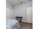 This bedroom features wood floors, a closet and a desk at 6148 Gracie Pl, Lakeland, FL 33812