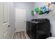 Laundry room with a washer and dryer, storage shelves, and convenient access for laundry tasks at 6148 Gracie Pl, Lakeland, FL 33812