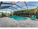 Screened pool and spa with lush landscaping offer a private outdoor oasis at 6148 Gracie Pl, Lakeland, FL 33812