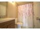 Cozy bathroom featuring a vanity with a vessel sink and a shower-tub combination with a decorative curtain at 634 Steamboat Ct # 171, Altamonte Springs, FL 32714