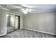 Neutral bedroom featuring plush gray carpet, ceiling fan, closet with sliding mirrored doors and crown moulding at 634 Steamboat Ct # 171, Altamonte Springs, FL 32714