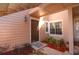 Inviting front entrance with a brown door, lantern and manicured landscaping at 634 Steamboat Ct # 171, Altamonte Springs, FL 32714