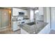 Efficient kitchen with granite countertops, white cabinets, and modern appliances, perfect for home cooking at 634 Steamboat Ct # 171, Altamonte Springs, FL 32714