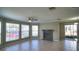Cozy living room with a fireplace, tile floors, and large windows offering natural light at 634 Steamboat Ct # 171, Altamonte Springs, FL 32714