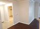 Bathroom with dark wood floors with walk-in shower is shown at 6412 Queens Borough Ave # 109, Orlando, FL 32835
