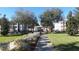 Sidewalk shot of the landscaped community including buildings, sidewalks, and green spaces at 6412 Queens Borough Ave # 109, Orlando, FL 32835