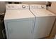 Laundry room with a GE washer and dryer at 6412 Queens Borough Ave # 109, Orlando, FL 32835