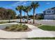 Well-maintained community showcasing manicured landscaping and modern architectural design complemented by blue skies at 645 Astera Winds Ln, Lake Mary, FL 32746