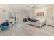 Bright primary bedroom features dual ceiling fans and large windows at 6850 Huntington Hills Blvd, Lakeland, FL 33810