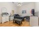Cozy bedroom with hardwood floors, white wicker drawers, and simple decor for a comfortable feel at 6850 Huntington Hills Blvd, Lakeland, FL 33810