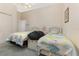 Bright bedroom featuring twin beds, and ample natural light, creating a welcoming space at 6850 Huntington Hills Blvd, Lakeland, FL 33810