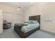 Comfortable bedroom with a ceiling fan, closet, and large window for natural light at 6850 Huntington Hills Blvd, Lakeland, FL 33810