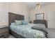 Relaxing bedroom featuring coordinated bedding, dresser, and a serene atmosphere at 6850 Huntington Hills Blvd, Lakeland, FL 33810