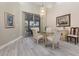 Dining area featuring sliding doors to the outdoors and chandelier lighting at 6850 Huntington Hills Blvd, Lakeland, FL 33810