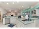 Open kitchen with white cabinetry, spacious counters, and stainless steel appliances at 6850 Huntington Hills Blvd, Lakeland, FL 33810