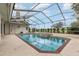 Enjoy the enclosed pool and jacuzzi with golf course views, perfect for relaxing and entertaining at 6850 Huntington Hills Blvd, Lakeland, FL 33810