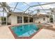 Screened-in pool area with jacuzzi offers a private outdoor oasis for relaxation and entertaining at 6850 Huntington Hills Blvd, Lakeland, FL 33810