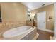 Modern bathroom featuring an oval soaking tub with tiled surround at 740 Hillcrest Ln, Altamonte Springs, FL 32701