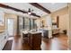 Bright kitchen featuring a central island, stainless steel appliances, and wooden beam accents at 740 Hillcrest Ln, Altamonte Springs, FL 32701