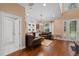 Cozy living room features a wet bar and hardwood floors at 740 Hillcrest Ln, Altamonte Springs, FL 32701