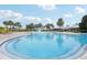 Large community pool with splash pad, poolside seating, and well-maintained surroundings at 8125 Atlantic Puffin St, Winter Garden, FL 34787