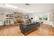 Inviting living room with hardwood floors, stone fireplace, built-in shelving, and natural light at 814 Seminole Ave, Orlando, FL 32804