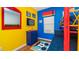 Brightly colored bedroom with bunk beds, TV, and cheerful decor at 8157 Fan Palm Way, Kissimmee, FL 34747