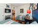 Cozy bedroom featuring two beds, wood floors, and ample closet space at 8157 Fan Palm Way, Kissimmee, FL 34747
