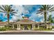 Attractive clubhouse exterior with well-maintained landscaping, showcasing a welcoming community space at 8157 Fan Palm Way, Kissimmee, FL 34747