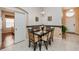 Cozy dining room with chandelier lighting and a dining table that seats four at 8157 Fan Palm Way, Kissimmee, FL 34747