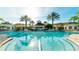 Clubhouse exterior showcasing beautiful architecture, manicured landscaping, and a welcoming entrance at 8157 Fan Palm Way, Kissimmee, FL 34747