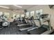 Well-equipped gym featuring modern treadmills, elliptical machines, and weightlifting equipment for a complete workout experience at 8157 Fan Palm Way, Kissimmee, FL 34747