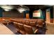 Private home theater with plush seating, large screen, and surround sound for an immersive viewing experience at 8157 Fan Palm Way, Kissimmee, FL 34747