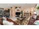 Open-concept living space with tile floors, comfortable seating, and seamless flow into the kitchen and dining areas at 8157 Fan Palm Way, Kissimmee, FL 34747
