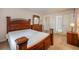 Bedroom with wooden furniture set, including a dresser, complemented by soft carpet flooring at 8215 Sun Spring Cir # 32, Orlando, FL 32825