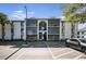 Condo building featuring multiple units with screened balconies and well-maintained landscaping at 8215 Sun Spring Cir # 32, Orlando, FL 32825