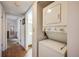 Laundry area featuring a stackable washer and dryer with view down the hall at 8215 Sun Spring Cir # 32, Orlando, FL 32825