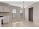 Open dining area with tile floors, natural light, and a chandelier at 902 Oleander St, New Smyrna Beach, FL 32168