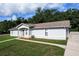 Lovely single-story home featuring a well-maintained lawn, charming curb appeal, and a cozy entrance at 902 Oleander St, New Smyrna Beach, FL 32168