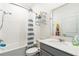 Full bathroom featuring a shower-tub combo with a white tile surround and modern vanity at 954 Laurel View Way, Groveland, FL 34736