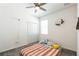 Cozy bedroom features soft carpet, closet, and a window providing natural light at 954 Laurel View Way, Groveland, FL 34736