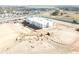 Aerial view of a new school building under construction in the community, showing the building's progress at 954 Laurel View Way, Groveland, FL 34736