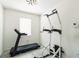 Workout space with tile flooring, a window for natural light, and workout equipment at 954 Laurel View Way, Groveland, FL 34736