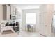 Modern kitchen featuring stainless steel appliances, quartz countertops, and a cozy breakfast nook at 954 Laurel View Way, Groveland, FL 34736