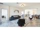 Spacious living room open to the kitchen with neutral tones at 954 Laurel View Way, Groveland, FL 34736