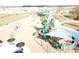 Community playground featuring swings, climbing structures, and shaded seating areas for families at 954 Laurel View Way, Groveland, FL 34736